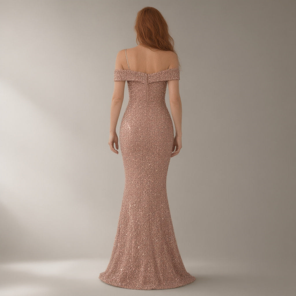 Woman seen from behind wearing the one-shoulder sequin mermaid evening gown – rose gold, back view