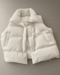 Women’s Short Padded Gilet – Cream, Black or Mocha, laid flat on a stone backdrop