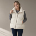 Woman wearing the short padded gilet – cream, black or mocha, full length, studio