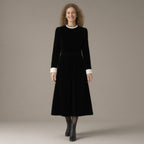 Woman wearing the pearl collar velvet midi dress, long sleeve – black, full length, studio