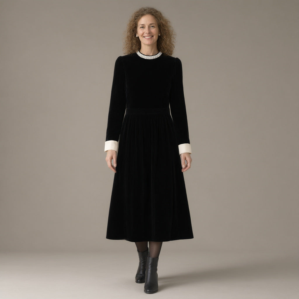 Woman wearing the pearl collar velvet midi dress, long sleeve – black, full length, studio
