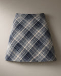 Women’s Plaid A-Line Mini Skirt, Brushed Check Weave, laid flat on a stone backdrop