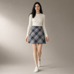 Woman wearing the plaid a-line mini skirt, brushed check weave, full length, studio