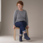 Woman wearing the ankle snow boots, plush lined, full length, studio