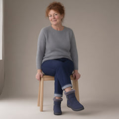 Woman wearing the ankle snow boots, plush lined, full length, studio