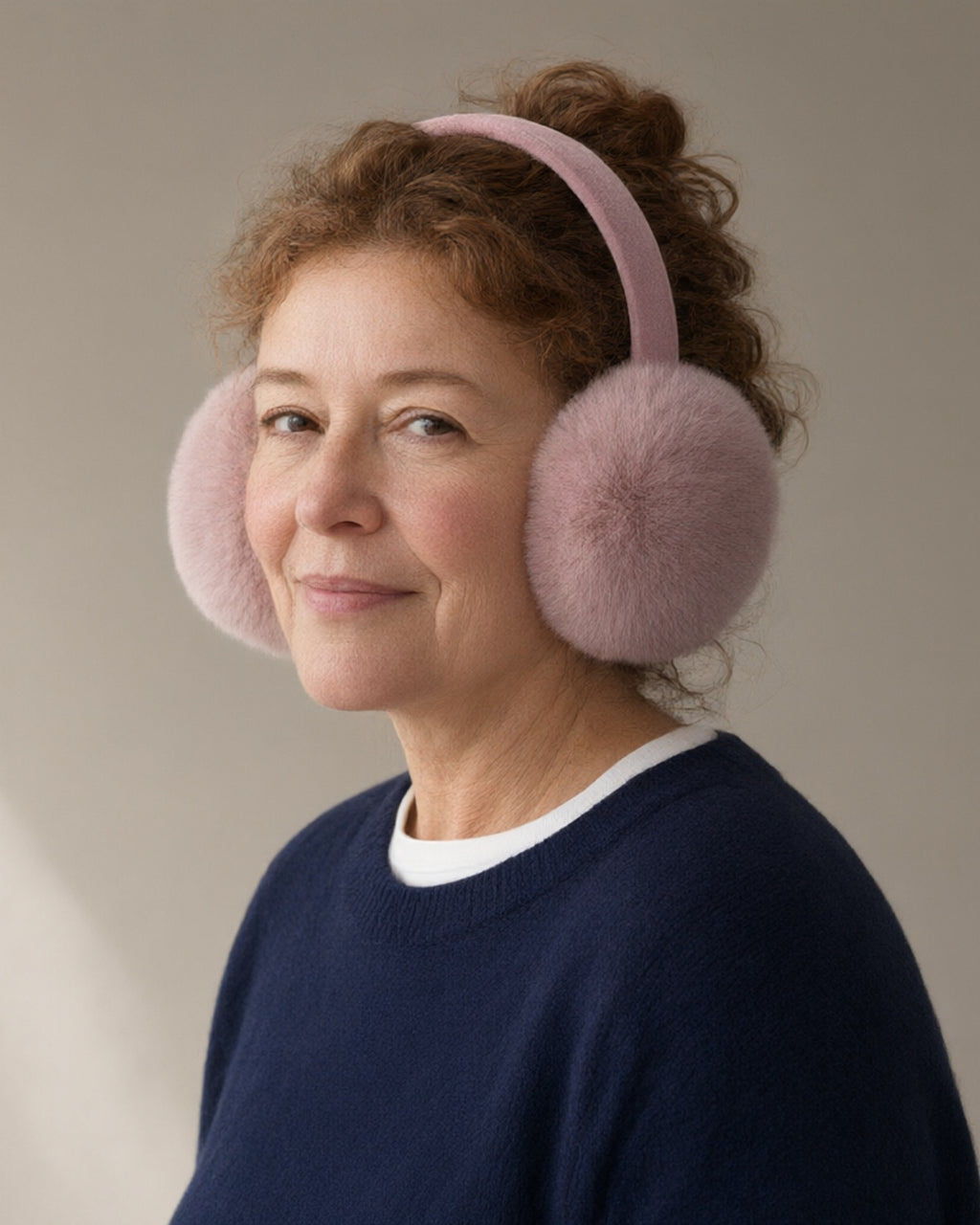 Woman wearing the plush earmuffs, full length, studio