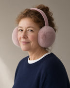 Woman wearing the plush earmuffs, full length, studio