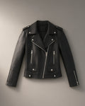 Women’s PU Biker Jacket, Short Zip-Front – Black, laid flat on a stone backdrop