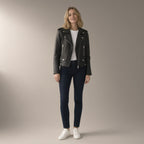 Woman wearing the pu biker jacket, short zip-front – black, full length, studio