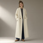 Woman wearing the relaxed double-faced wool coat, wide collar, full length, studio