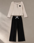 Women’s Ribbed Knit Lounge Set, laid flat on a stone backdrop