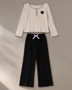 Women’s Ribbed Knit Lounge Set, laid flat on a stone backdrop