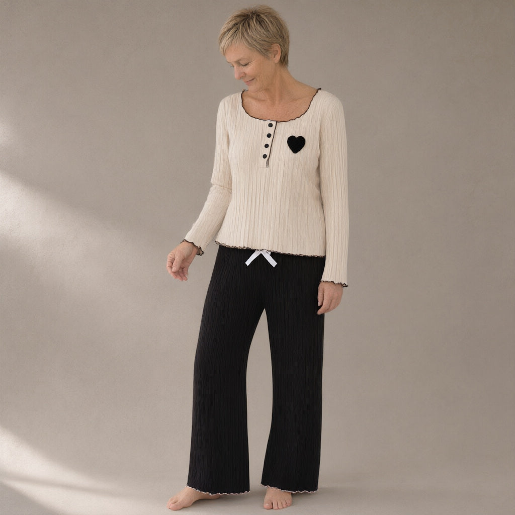 Woman wearing the ribbed knit lounge set, three-quarter view, studio
