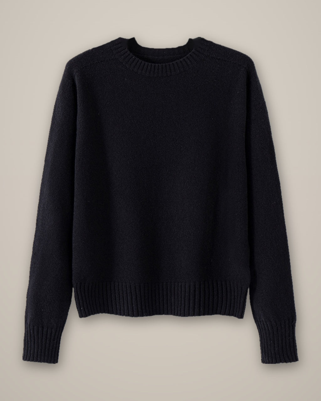 Women’s Wool Jumper, Round Neck, 100% Wool, laid flat on a stone backdrop