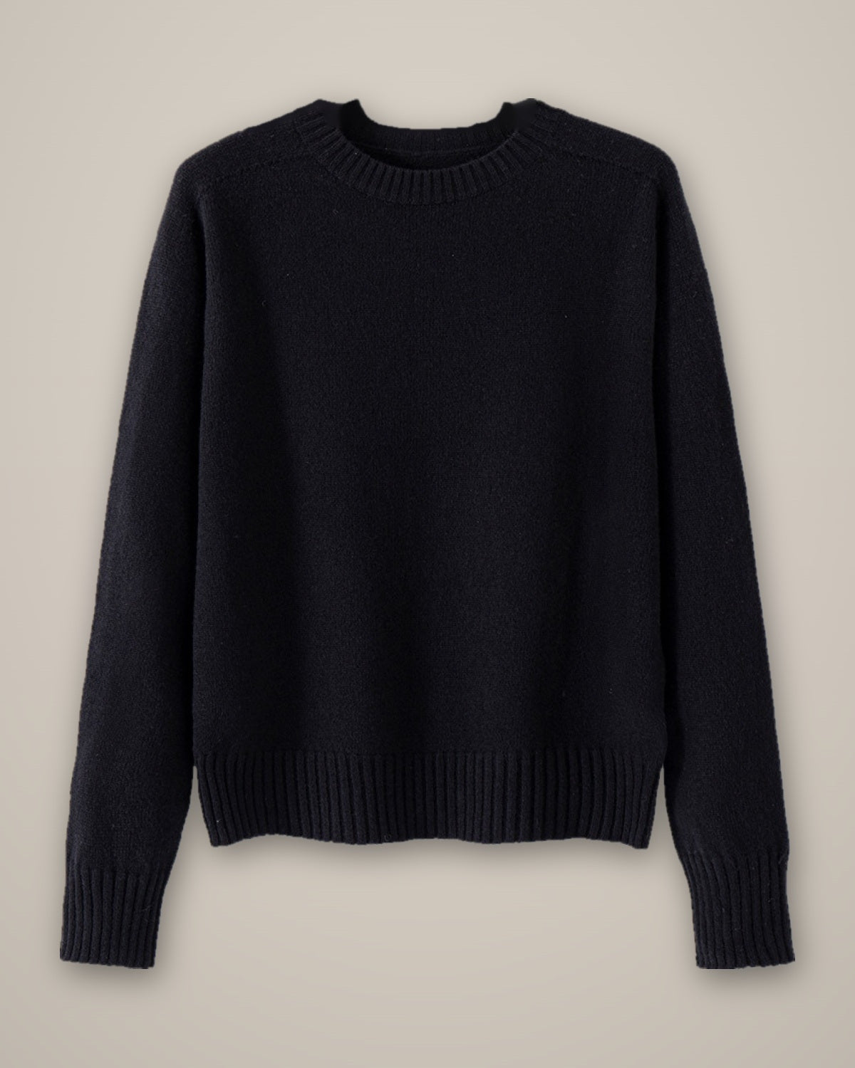 Women’s Wool Jumper, Round Neck, 100% Wool, laid flat on a stone backdrop