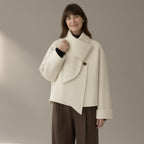 Woman wearing the short scarf-collar double-faced coat, 95%+ wool, three-quarter view, studio