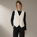 Woman wearing the tailored v-neck waistcoat, adjustable back, three-quarter view, studio