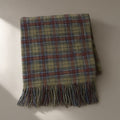 Women’s Tasselled Plaid Scarf, 200 x 50cm, laid flat on a stone backdrop
