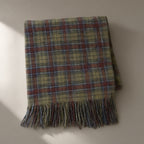 Women’s Tasselled Plaid Scarf, 200 x 50cm, laid flat on a stone backdrop