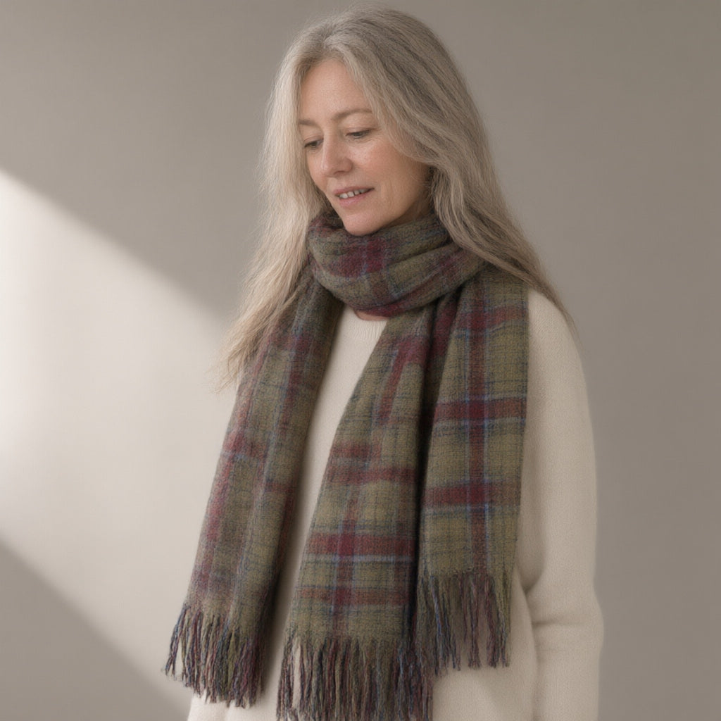 Woman wearing the tasselled plaid scarf, 200 x 50cm, three-quarter view, studio