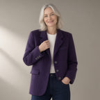 Woman wearing the double-faced wool blend blazer, single-breasted, three-quarter view, studio