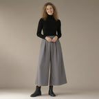 Woman wearing the wool-look wide-leg culottes, high waist, full length, studio