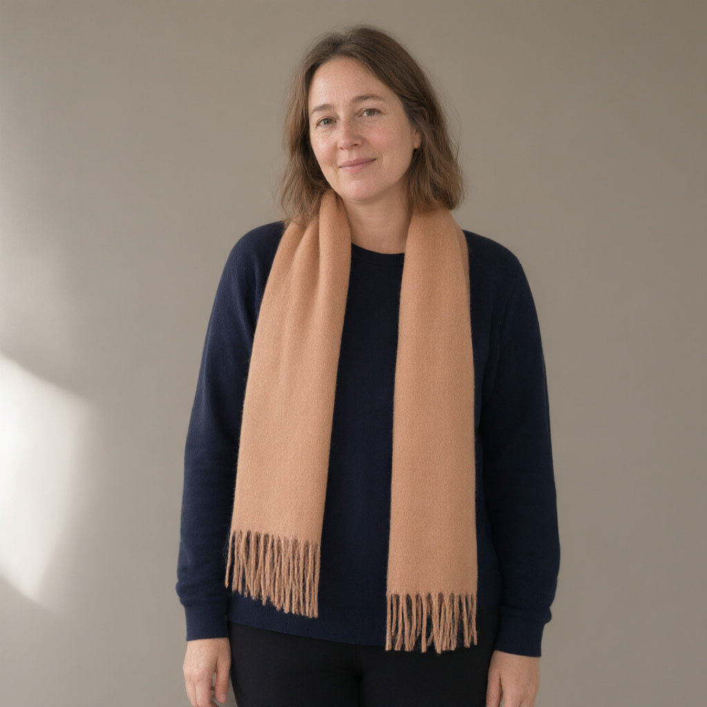 Woman wearing the wool scarf with fringe, 32 x 180 cm, full length, studio