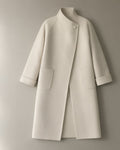 Women’s Long Wrap Coat, Stand Collar & Tie Belt, laid flat on a stone backdrop