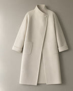 Women’s Long Wrap Coat, Stand Collar & Tie Belt, laid flat on a stone backdrop