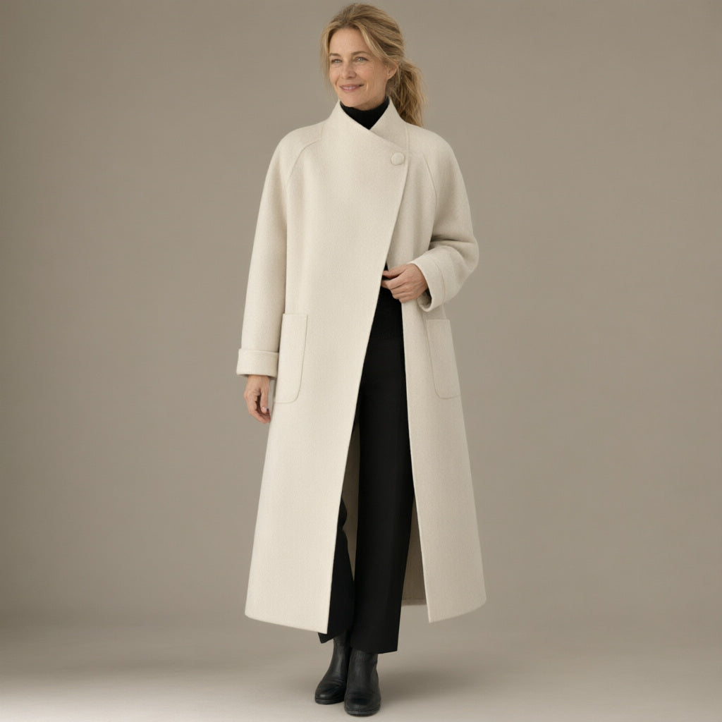 Woman wearing the long wrap coat, stand collar & tie belt, full length, studio