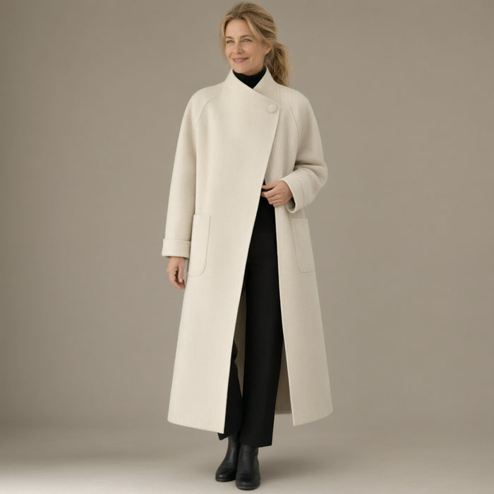 Woman wearing the long wrap coat, stand collar & tie belt, full length, studio